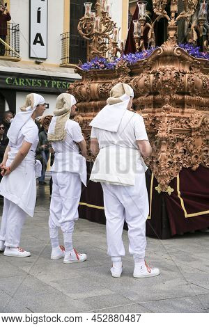 Elche, Spain- April 13, 2022: Bearers Of Easter Parade Through The Streets Of Elche City In The Holy
