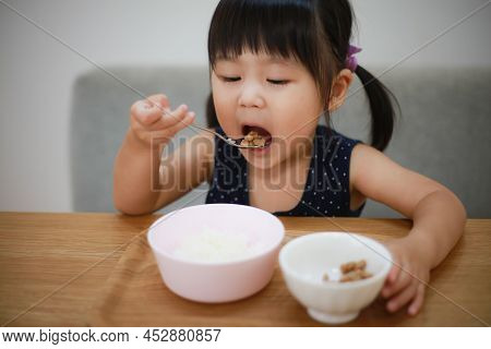 Image Of A Girl Eating Natto Rice
