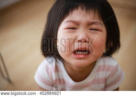 Image Of A Girl Crying At Home