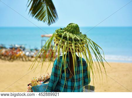 Coconut Hat Seller At Chaung Thar Beach, Myanmar