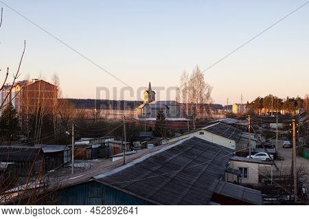 Belarus, Postavy - 20 March, 2022: Roofs Of Village Houses At Dawn Close Up