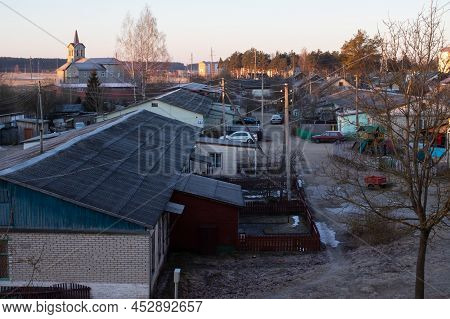 Belarus, Postavy - 20 March, 2022: Roofs Of Village Houses At Dawn Close Up