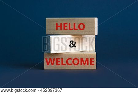 Hello And Welcome Symbol. Concept Words Hello And Welcome On Wooden Blocks. Beautiful Grey Backgroun