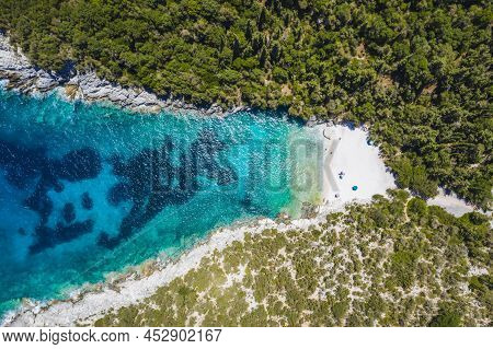 Aerial Top Down View Of Dafnoudi Beach In Kefalonia, Greece. Remote Bay With Pure Crystal Clean Turq