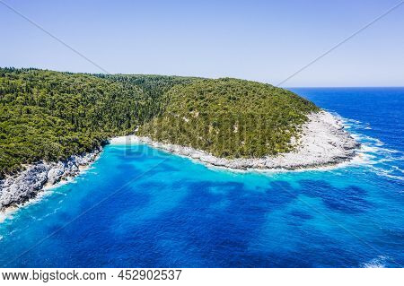 Aerial View Of Remote Dafnoudi Beach In Kefalonia, Greece. Secluded Bay With Pure Crystal Clean Turq