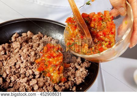 Preparation Of Ground Beef With The Traditional Colombian Hogao Or Criollo Sauce (salsa Criolla) Mad