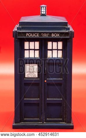 Police Call Box Isolated On Red Background. Tardis From Doctor Who.