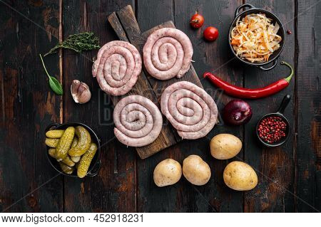 Fried Bavarian German Nürnberger Sausages With Sauerkraut, Mashed Potatoe, On Old Dark  Wooden Table