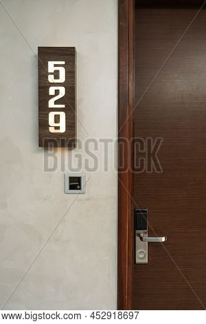 Room Number Or Name Plate Sign On The Wooden Wall For Hotel Or Resort