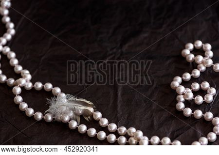 Feminine Desktop Mockup With Pearls On Black Paper Background With Copy Space.