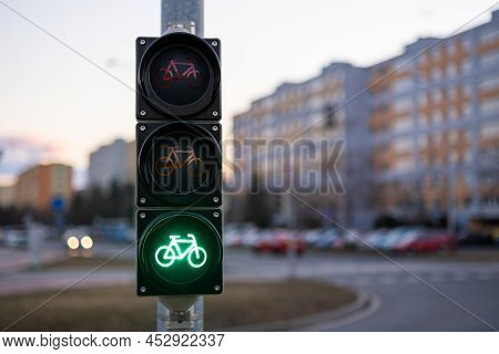 Traffic Green Light Letting Bicycle To Pass In Public Place. Green Light Gives Cyclist Priority Agai