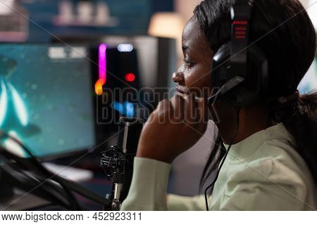 Cyber Woman Gamer Talking Into Microphone During Live Streaming While Playing Online Video Games Dur