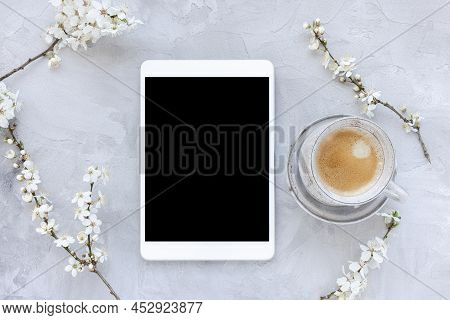Digital Tablet Mock-up And Spring White Cherry Blossom Flowers And Morning Coffee Cup. Online Shoppi