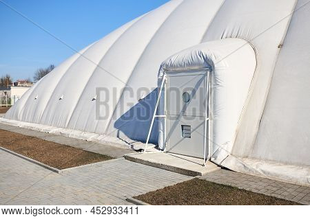 Inflatable Air Dome Stadium. Inflated Tennis Air Dome Or Tennis Bubble Arena Entrance Door Into Stru
