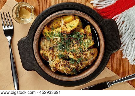 Baked Potatoes Wedges With Fried Onion And Dill In Traditional Georgian Clay Ketsi