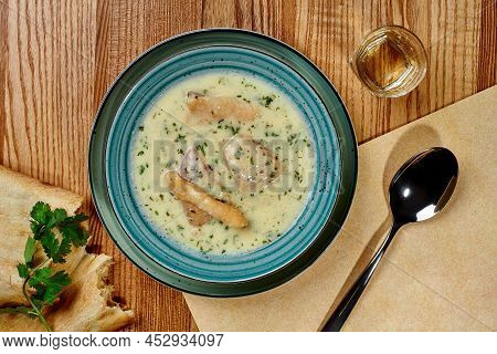 Creamy Chicken Chikhirtma Soup With Shotis Puri And Glass Of Chacha