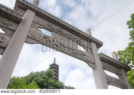 A Chinese Gate With Cishou Pagoda In The Background At Jinshan Temple In Zhenjiang China.