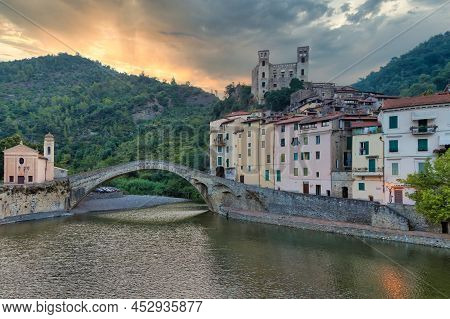 Dolceacqua, Italy - Circa August 2020: Dolceacqua Panorama With The Ancient Roman Bridge Made Of Sto