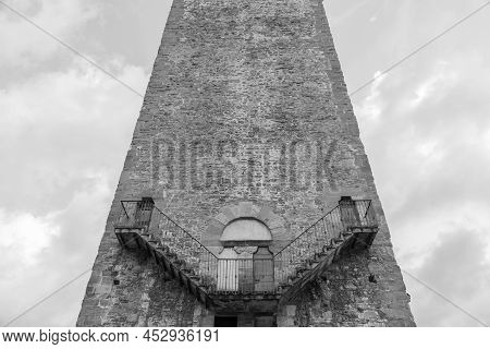 Exterior Of Antique Tower Building With Escher Architecture Style. Simmetry And Geometric Perspectiv