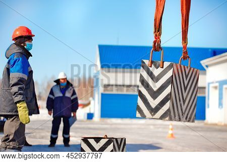 Working Slinger Passes Exam On Lifting Loads. Real Scene. Commission Evaluates Skill Of Slinger. Wor