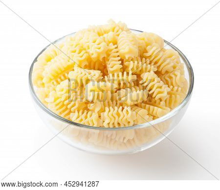 Uncooked Radiatori Pasta In Glass Bowl Isolated On White Background With Clipping Path