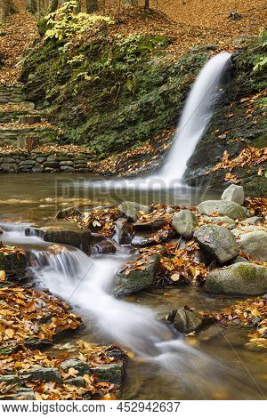 Autumn Nature Landscape With Leaf Fall On Waterfall  Krutylo In Mountain Gorge On Turichka River. Lu