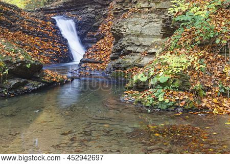 Nature Landscape With Leaf Fall On Waterfall  In Mountain Gorge On Turichka River. Lumshory Village 