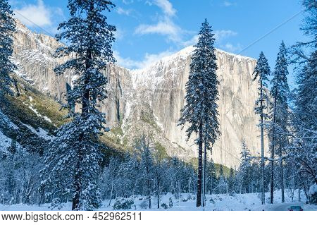 View From The Snow-covered Valley Floow In Yosemite National Park During Golden Hour, Just Before Su