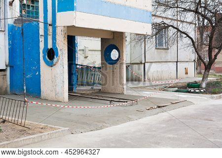 New Concrete Blind Area Apartment Building. Blind Area Fenced With Red-white Barrier Tape. Process O