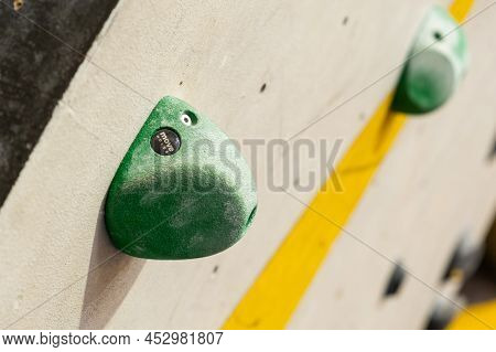 Stone Hooks Or Grips On The Artificial Climbing Wall In Bouldering Gym.