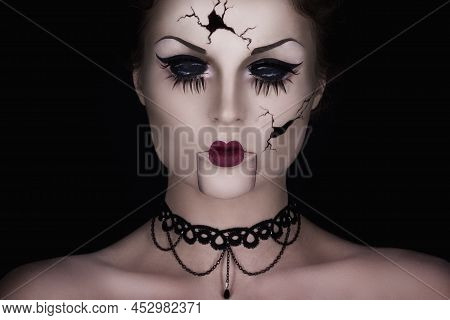 Model In Creative Image. Spooky Talking Broken Doll.