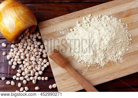 Organic Homemade Chickpea Flour Over Rustic Wooden Table. Gluten Free