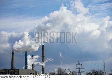 Bucharest, Romania - March 10, 2022: The Chimneys Of The Cet Sud Power Plant, Which Pollute With Smo