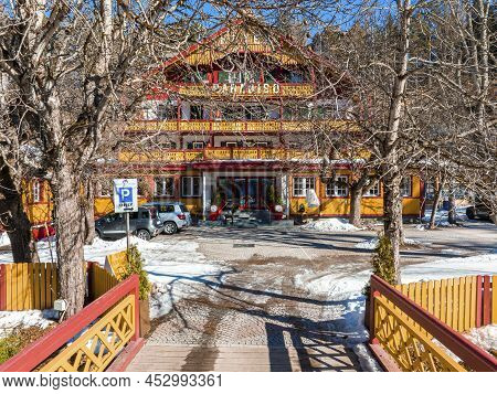 Beautiful Exterior Of Wooden Chalet Restaurant Facade During Winter Season