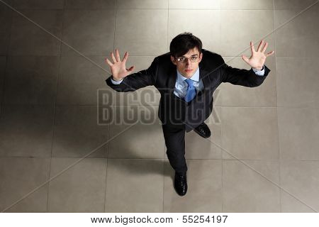 Image of young businessman in glasses. Top view