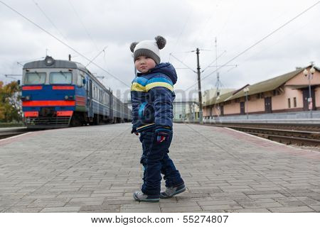 Boy Stands On The Platform