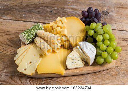 Cheese Plate Variation On A Wooden Table