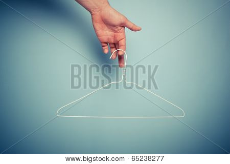 Hand Holding Wire Hanger