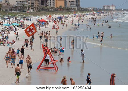 JACKSONVILLE BEACH, FL-MAY 18, 2014: Crowds enjoying Jacksonville Beach on a weekend. Jacksonville Beach is 15 miles east of Jacksonville and has a population of 21,362 at the 2010 census.