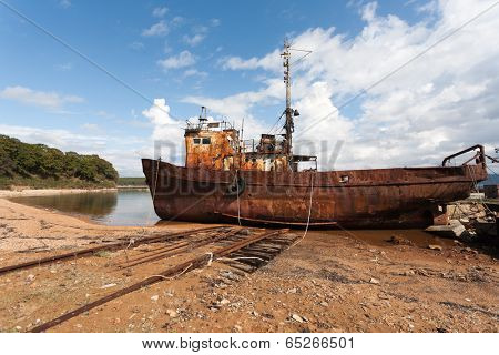 Fishing boat in the sea port in the old slip dock.