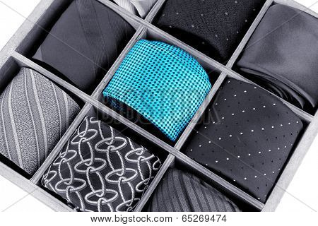 Concept of individuality.One bright color necktie among grey neckties