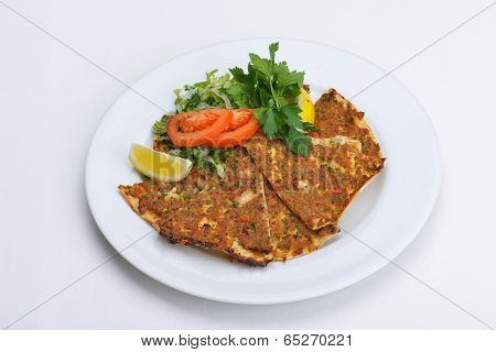 Homemade traditional Turkish meal pide stuffed with meat cheese,  and sauce isolated on white background