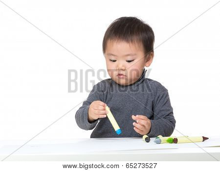 Little boy concentrate on drawing
