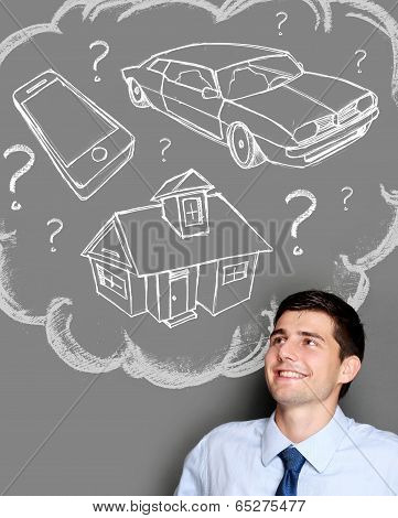 Business Man Dreaming Of Buying House, Car Or Gadget