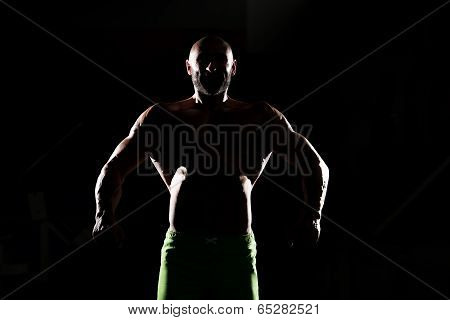 Siluet Muscular Man Flexing Muscles