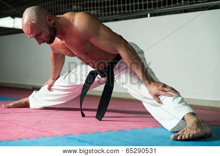 Mature Man Warming Up And Stretching