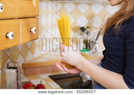 Woman Holding Pack Of Unboiled Noodles
