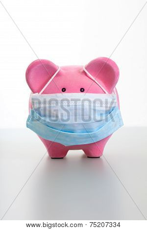 Piggy Bank With Face Mask - Swine Flu Concept