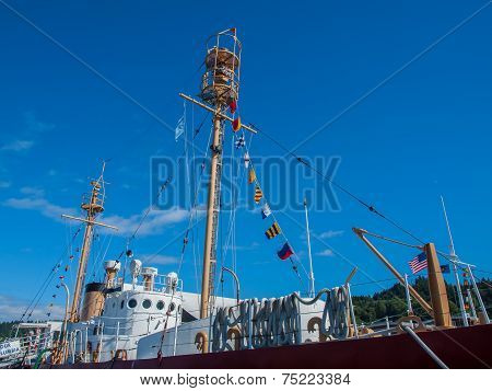 Columbia Lightship With Nautical And American Flags Hanging
