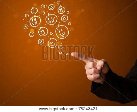 Group of happy hand drawed smiley faces coming out of gun shaped hands